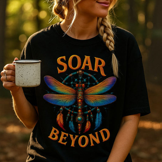 Person wearing a black t-shirt with 'Soar Beyond' design, holding a mug in a forest setting.